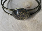Armband - Dodecagram der heiligen Geometrie als nachtschwarzer ca. 25 mm großer Coin (ginter Glas) mit Goldlegierung in ein bronzefarbendes Schapparmband eingearbeitet, Kupfer unterlegt