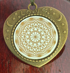 Amulett – bronzefarben, Lakhovsky MWOn Symbol, Disc in weiß 25 mm, goldlegiert, kupferunterlegt – Produktansicht 1