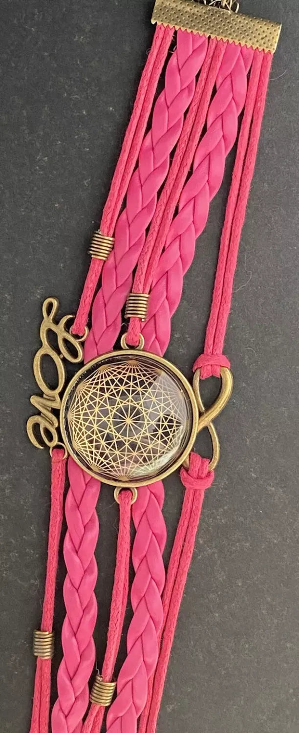 Armband - Dodecagram als nachtschwarzer ca. 25 mm großer Coin (hinter Glas) mit Goldlegierung in pinkes mehrsträngiges Band eingearbeitet