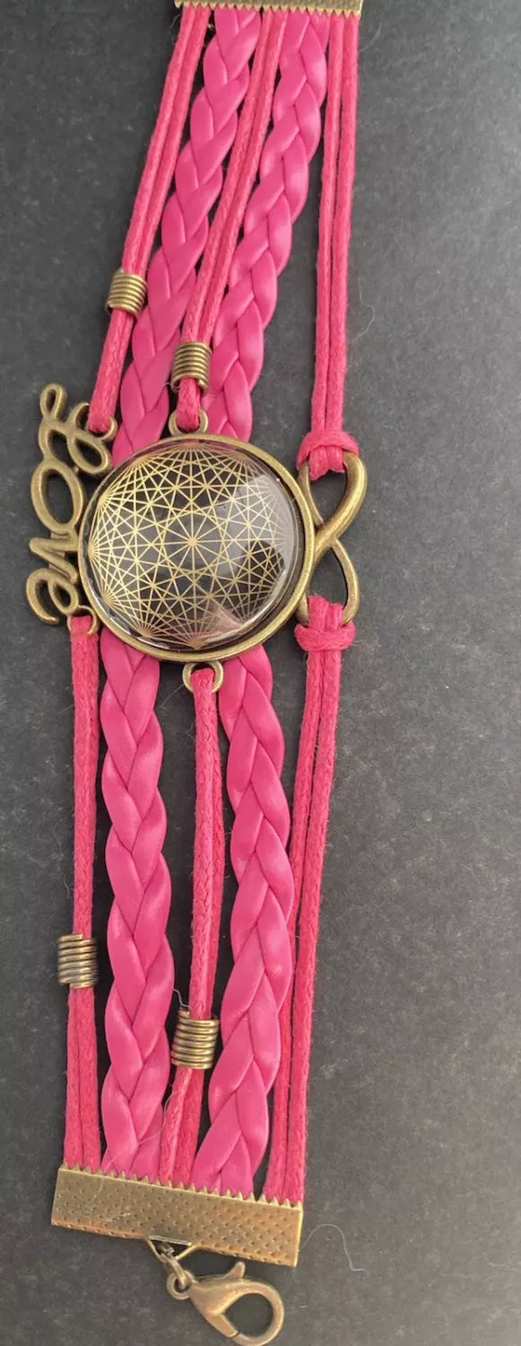 Armband - Dodecagram als nachtschwarzer ca. 25 mm großer Coin (hinter Glas) mit Goldlegierung in pinkes mehrsträngiges Band eingearbeitet
