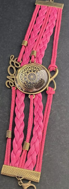 Armband - Dodecagram als nachtschwarzer ca. 25 mm großer Coin (hinter Glas) mit Goldlegierung in pinkes mehrsträngiges Band eingearbeitet