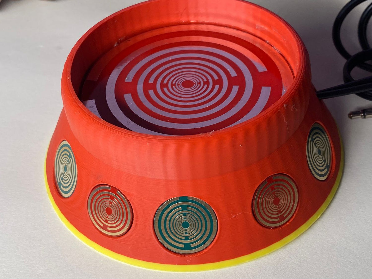 69 mm VibraNex UFO – 2-farbig, Oberflächenplatte zinnlegiert – EINZELSTÜCK – Produktansicht 1